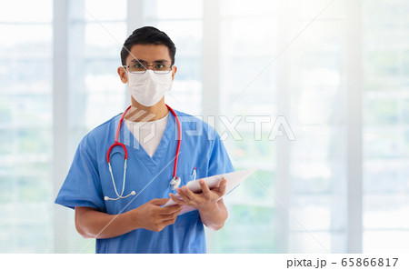 Doctor or nurse with stethoscope and face mask. Doctor or nurse with stethoscope and face mask. 65866817