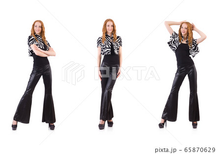 Redhead woman in black bell bottom pants on white Redhead woman in black bell bottom pants on white 65870629