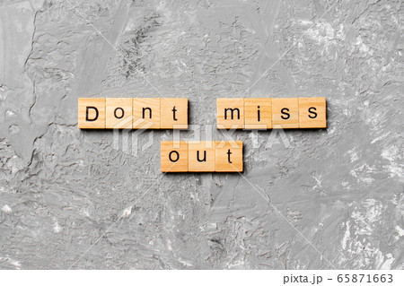 Don't miss out word written on wood block. Don't Don't miss out word written on wood block. Don't 65871663