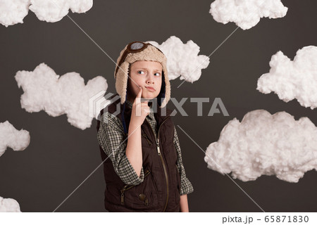a girl dressed in a retro style jacket and helmet 65871830