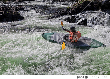 Kayaker in whitewater Kayaker in whitewater 65872838