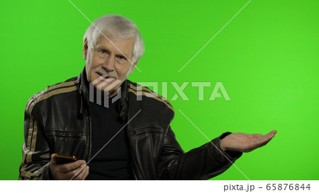 Elderly grandfather man using smartphone, pointing at something with hand 65876844