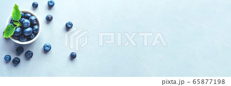 Fresh blueberries in a white bowl. 65877198