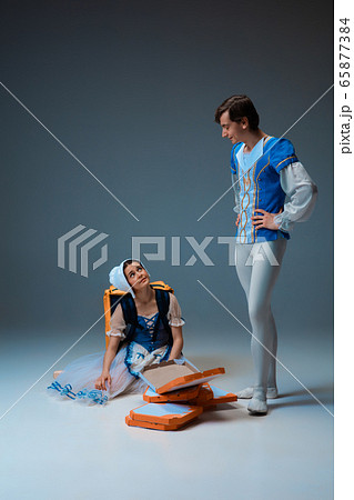 Young and graceful ballet dancers as Cinderella fairytail characters hurrying up with pizza like deliveryman Young and graceful ballet dancers as Cinderella fairytail characters hurrying up with pizza like deliveryman 65877384