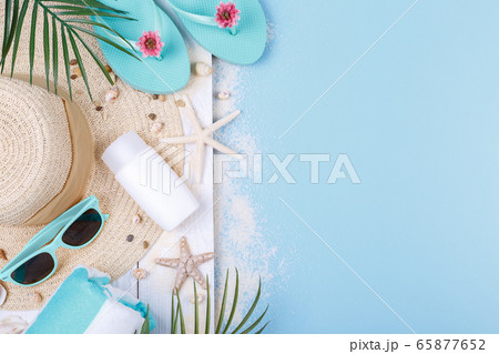 Beach accessories on the blue background 65877652