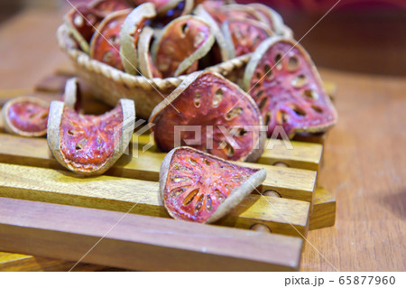 Slices of Bael fruit, matum, for tea and ingredient of food. Slices of Bael fruit, matum, for tea and ingredient of food. 65877960