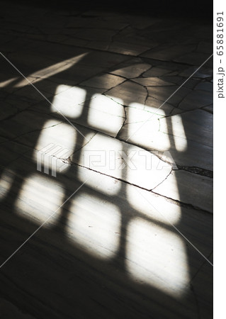 Shadow of the window on the concrete floor. 65881691