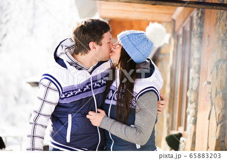Family in love laughing and cooking in the winter outdoors. Bonfire, barbecue, bowler. Family in love laughing and cooking in the winter outdoors. Bonfire, barbecue, bowler. 65883203