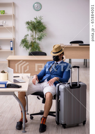 Businessman preparing for trip during pandemic Businessman preparing for trip during pandemic 65884001