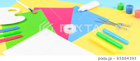 Color paper, paint and school stationery on blue 65884393