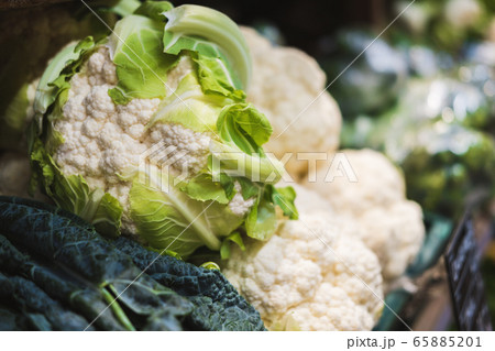 Banner of fresh cauliflower on the counter in a supermarket, market, greengrocery. Banner of fresh cauliflower on the counter in a supermarket, market, greengrocery. 65885201