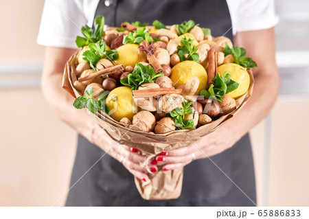 A large beautiful fruit bouquet of lemons, nuts A large beautiful fruit bouquet of lemons, nuts 65886833