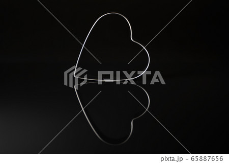 Metal heart and its reflection 65887656