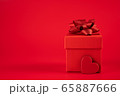 Red gift box with a red bow and heart 65887666