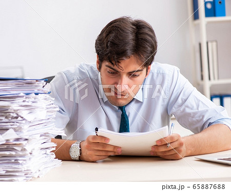Overloaded busy employee with too much work and paperwork 65887688