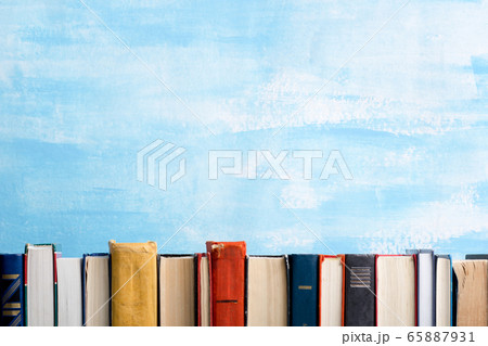 Books on wooden desk table and abstract background. Education background. Copy Space. Back to school. 65887931