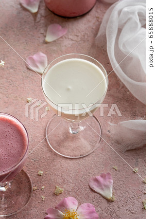 A glass of goat kefir on a pink background A glass of goat kefir on a pink background 65888015