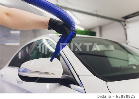 Car interior textile seats chemical cleaning with professionally extraction method. Early spring cleaning or regular clean up. 65888925