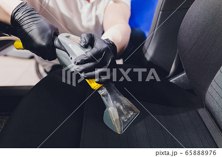 Car interior textile seats chemical cleaning with professionally extraction method. Early spring cleaning or regular clean up. Car interior textile seats chemical cleaning with professionally extraction method. Early spring cleaning or regular clean up. 65888976