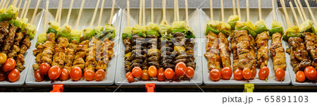 Skewers of grilled vegetables and meat in night market, thailand Skewers of grilled vegetables and meat in night market, thailand 65891103