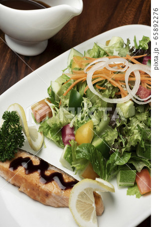 organic mixed vegetable salad with salmon fillet 65892276