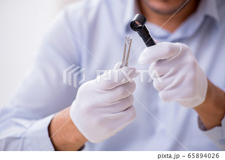 Young male jeweler at workshop Young male jeweler at workshop 65894026