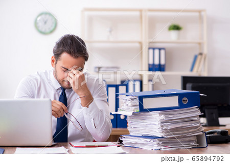 Two employees working in the office Two employees working in the office 65894792