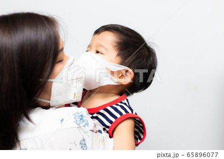 Asian mother carry baby boy wear mask protect 65896077