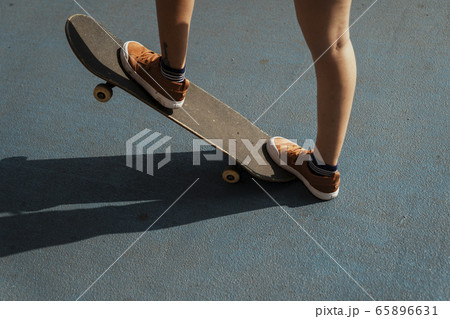 Girl on skateboard. 65896631