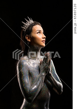 topless brunette with glitter bodyart and crown 65897120