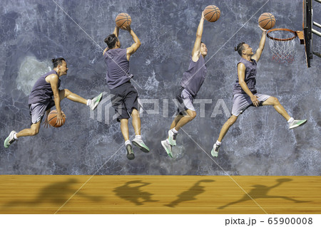 Basketball in hand man jumping Throw a basketball hoop On the wooden floor Background plaster wall loft with The pattern of cracks. Basketball in hand man jumping Throw a basketball hoop On the wooden floor Background plaster wall loft with The pattern of cracks. 65900008