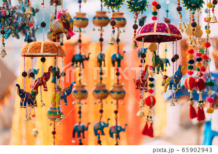 Goa, India. Set Of Small Miniature Indian Elephant Toys And Bells At Local Goa Market. Popular Souvenirs From India Goa, India. Set Of Small Miniature Indian Elephant Toys And Bells At Local Goa Market. Popular Souvenirs From India 65902943
