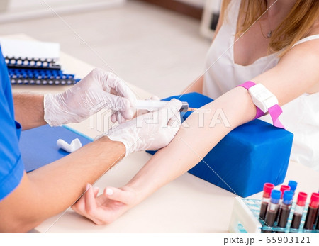 Young patient during blood test sampling procedure Young patient during blood test sampling procedure 65903121