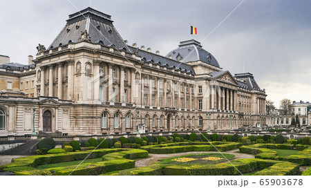 The Royal Palace in Brussels, Belgium from the northeastern corner in spring. National flag of the Kingdom of Belgium waving on top. The Royal Palace in Brussels, Belgium from the northeastern corner in spring. National flag of the Kingdom of Belgium waving on top. 65903678