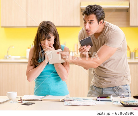 Young family struggling with personal finance 65903990