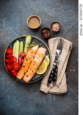 Fried salmon steak and vegetables 65906536