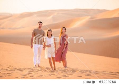People among dunes in Rub al-Khali desert in United Arab Emirates 65909288