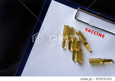 Close-up glass ampoules with Covid-19 vaccine 65910101