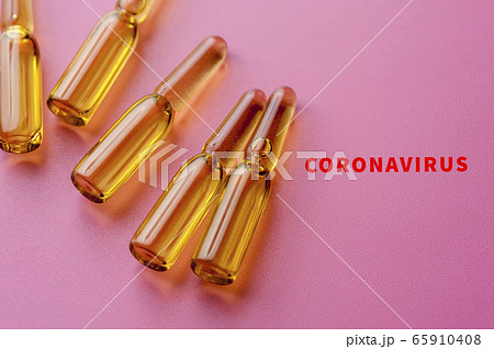 Close-up glass ampoules with Covid-19 vaccine Close-up glass ampoules with Covid-19 vaccine 65910408