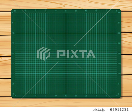 Cutting Mat on wood texture background. Green Cutting Mat. 65911251
