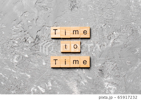 Time to time word written on wood block. Time to 65917232
