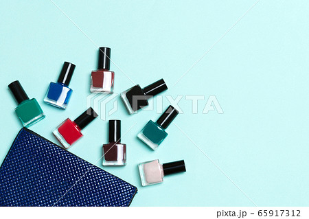 Top view of the set of nail polishes and bright Top view of the set of nail polishes and bright 65917312