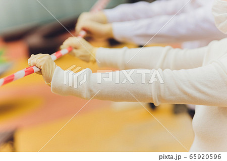 the epidemiologist in the zone of infection, surrounded by a warning tape. In the light of sirens. 65920596