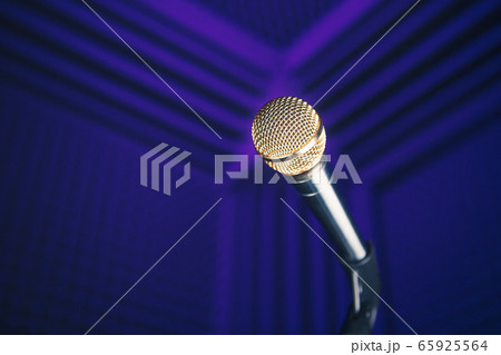 golden microphone on stand, purple background with golden microphone on stand, purple background with 65925564