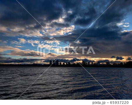 Dawn on the river bank with clouds in the city of Kiev Dawn on the river bank with clouds in the city of Kiev 65937220