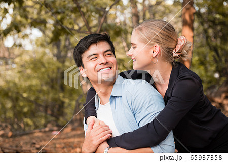 young romance couple relax in the park 65937358