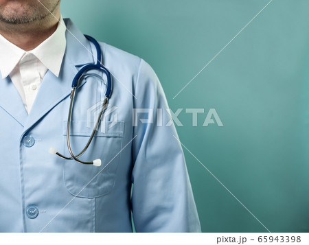 Man in protective suit and medical mask on blue 65943398
