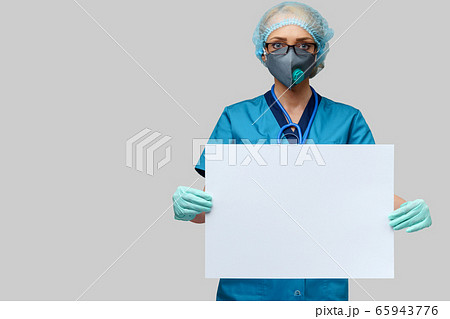 female doctor with stethoscope wearing protective mask and latex gloves holding blank sign over light grey background 65943776