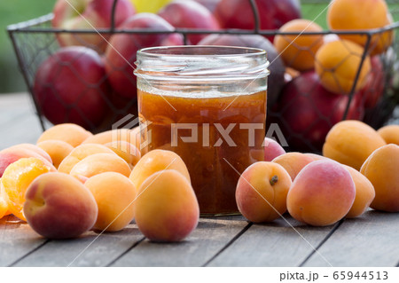 Apricots and pot of jam Apricots and pot of jam 65944513
