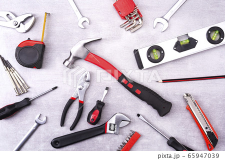 Coplet of repair tools on a gray background. Equipment for construction. Repair tool kit. View from above 65947039